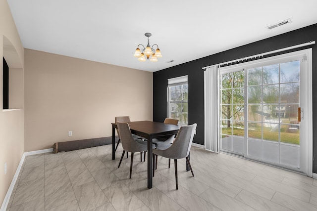 100 Maximus, Greer, SC 29651 - dining space with a chandelier and baseboards