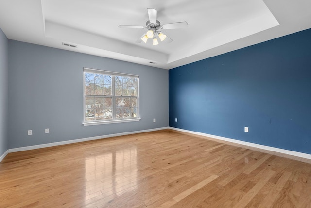 100 Maximus, Greer, SC 29651 - empty room with a tray ceiling, baseboards, light wood-type flooring, and ceiling fan
