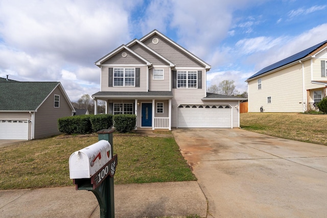 100 Maximus, Greer, SC 29651 - view of front facade featuring driveway, a front yard, and covered porch