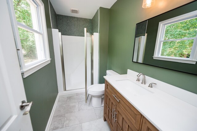 1635 Riveroak Rd, Inman, SC 29349 - full bath with toilet, vanity, baseboards, a walk in shower, and healthy amount of natural light