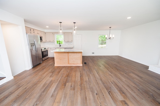 1635 Riveroak Rd, Inman, SC 29349 - kitchen featuring appliances with stainless steel finishes, light countertops, a chandelier, a sink, and wood finished floors