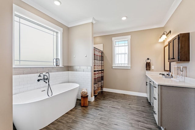 222 Blease Horton, Boiling Springs, SC 29316 - full bathroom with vanity, a freestanding bath, ornamental molding, wood finished floors, and tile walls
