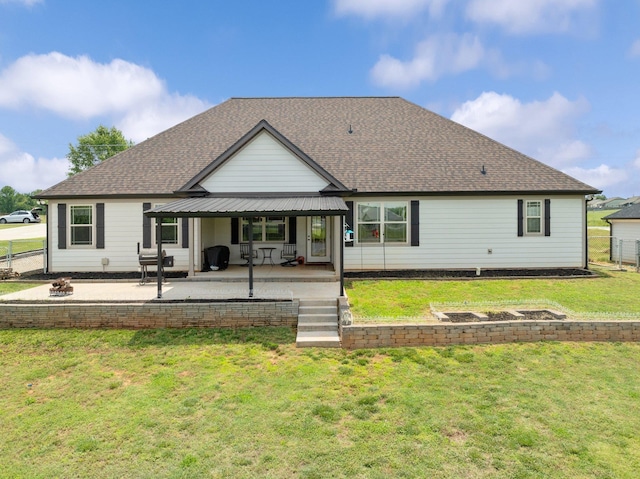 222 Blease Horton, Boiling Springs, SC 29316 - back of property featuring a shingled roof, a patio, and an outdoor fire pit