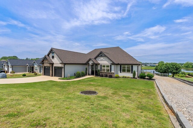 222 Blease Horton, Boiling Springs, SC 29316 - view of front of property with concrete driveway, board and batten siding, a front yard, and a water view