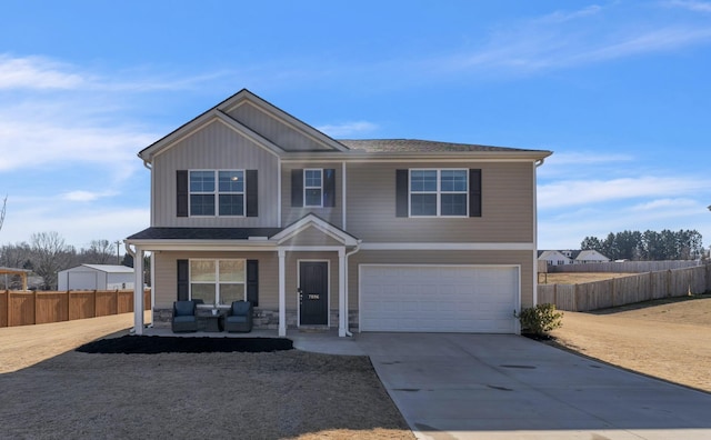 7096 Luna Mae, Boiling Springs, SC 29316 - view of front of house featuring covered porch, a garage, driveway, and stone siding