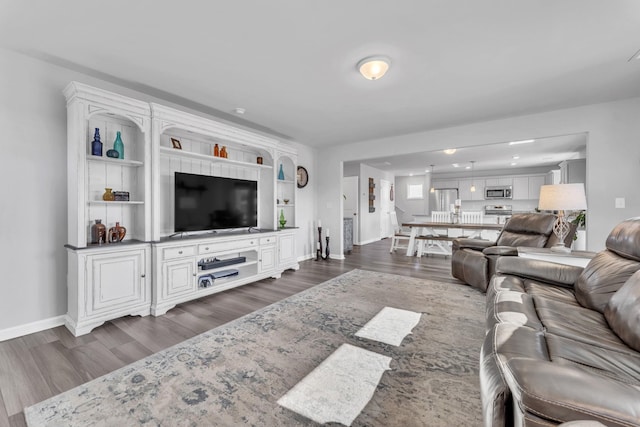 7096 Luna Mae, Boiling Springs, SC 29316 - living room with dark wood-style floors and baseboards