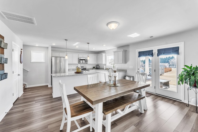 7096 Luna Mae, Boiling Springs, SC 29316 - dining area featuring recessed lighting, baseboards, dark wood finished floors, and plenty of natural light