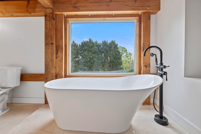 868 Old Hundred, Pelzer, SC 29669 - bathroom with a freestanding tub, plenty of natural light, and baseboards