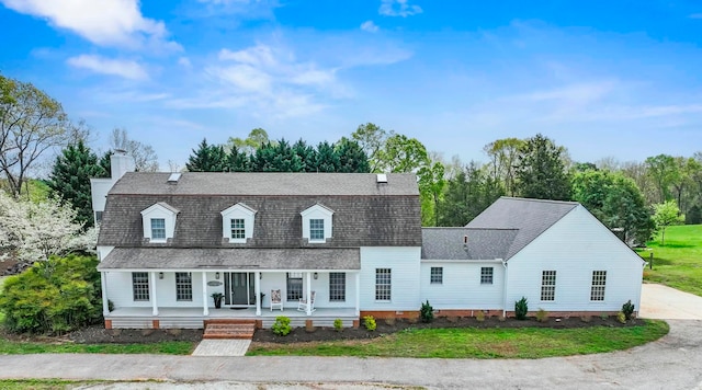868 Old Hundred, Pelzer, SC 29669 - view of front facade featuring covered porch, a shingled roof, a chimney, crawl space, and a gambrel roof