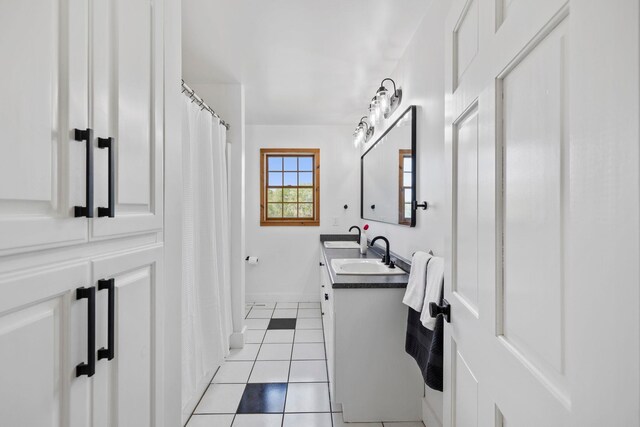 868 Old Hundred, Pelzer, SC 29669 - bathroom with double vanity, tile patterned flooring, a shower with shower curtain, and baseboards