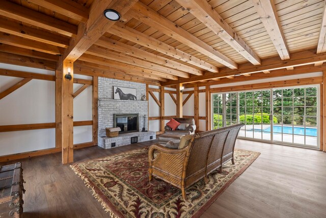 868 Old Hundred, Pelzer, SC 29669 - living area featuring a fireplace, wood ceiling with exposed beams, and wood finished floors
