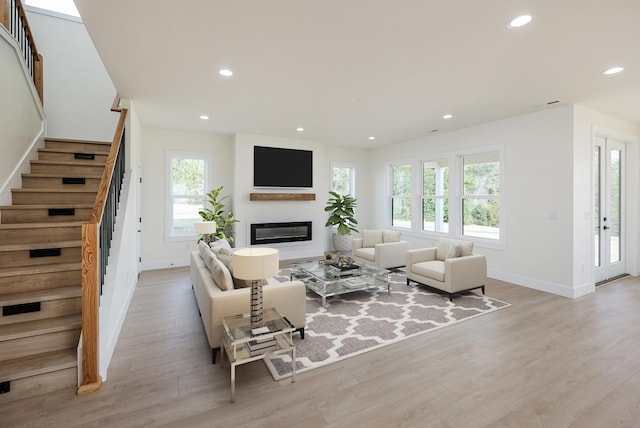 3621 Pennington, Greer, SC 29651 - living area featuring stairs, plenty of natural light, a glass covered fireplace, recessed lighting, and light wood finished floors