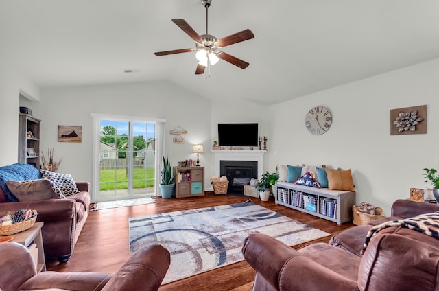 651 Willow Bank, Moore, SC 29369 - living room featuring lofted ceiling, a ceiling fan, a glass covered fireplace, and wood finished floors