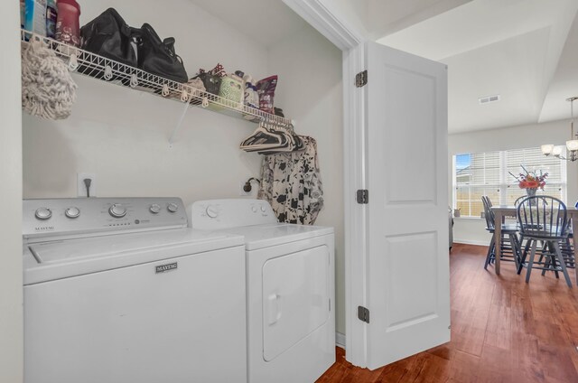 651 Willow Bank, Moore, SC 29369 - laundry room with washer and clothes dryer, dark wood-style floors, and a chandelier