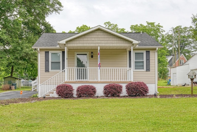 9 Powell, Inman, SC 29349 - bungalow featuring a porch, a front lawn, and a shingled roof