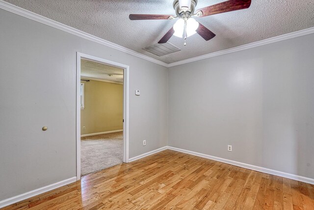 9 Powell, Inman, SC 29349 - spare room with a textured ceiling, light wood-type flooring, a ceiling fan, baseboards, and ornamental molding