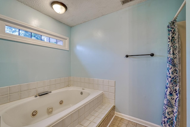 9 Powell, Inman, SC 29349 - full bathroom featuring a jetted tub, tile patterned flooring, a textured ceiling, baseboards, and a shower with curtain