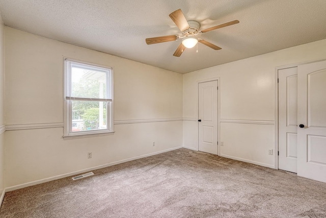 9 Powell, Inman, SC 29349 - unfurnished bedroom with carpet flooring, a textured ceiling, baseboards, and ceiling fan