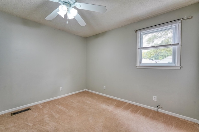 9 Powell, Inman, SC 29349 - unfurnished room featuring light colored carpet, baseboards, ceiling fan, and a textured ceiling