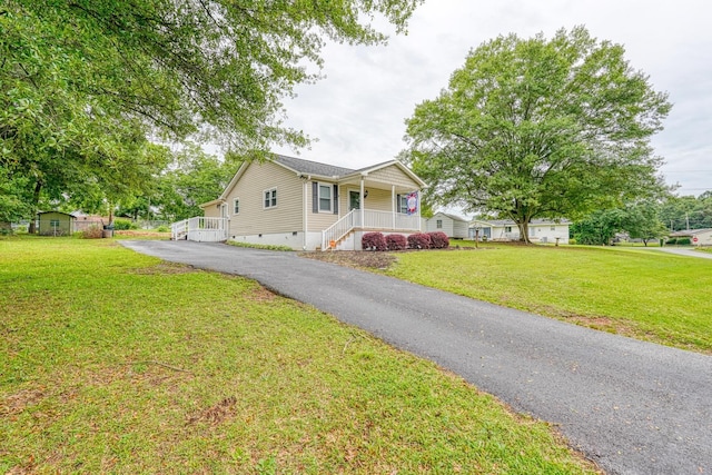 9 Powell, Inman, SC 29349 - view of front of house featuring crawl space, covered porch, asphalt driveway, and a front yard