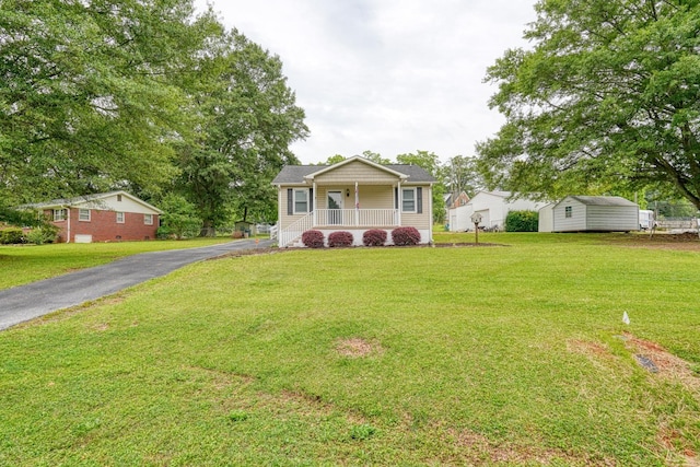 9 Powell, Inman, SC 29349 - view of front of house with covered porch and a front lawn