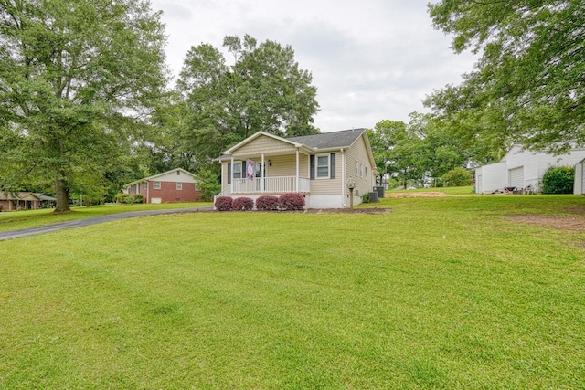 9 Powell, Inman, SC 29349 - view of front of property with a porch, a front yard, cooling unit, and asphalt driveway