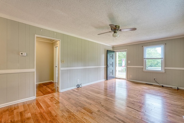 9 Powell, Inman, SC 29349 - spare room with a textured ceiling, wood-type flooring, ceiling fan, ornamental molding, and baseboards