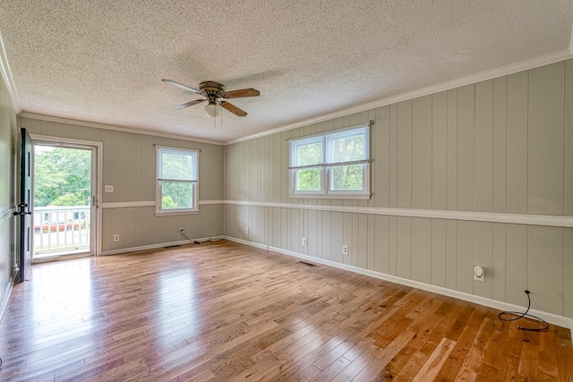 9 Powell, Inman, SC 29349 - unfurnished room featuring hardwood / wood-style flooring, a textured ceiling, ceiling fan, and crown molding