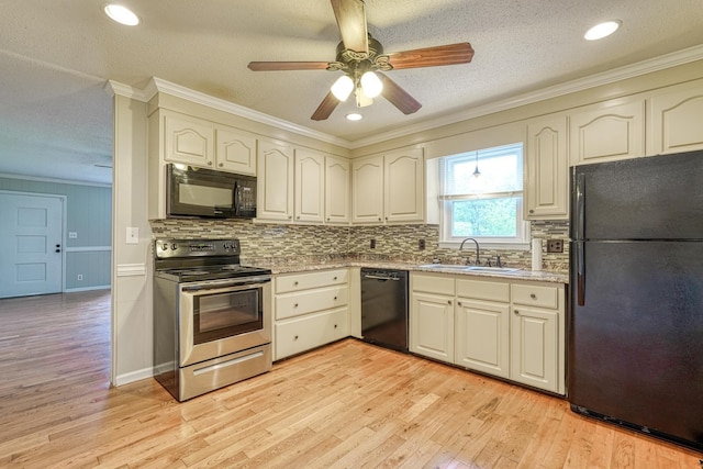 9 Powell, Inman, SC 29349 - kitchen with black appliances, a sink, light wood finished floors, crown molding, and decorative backsplash