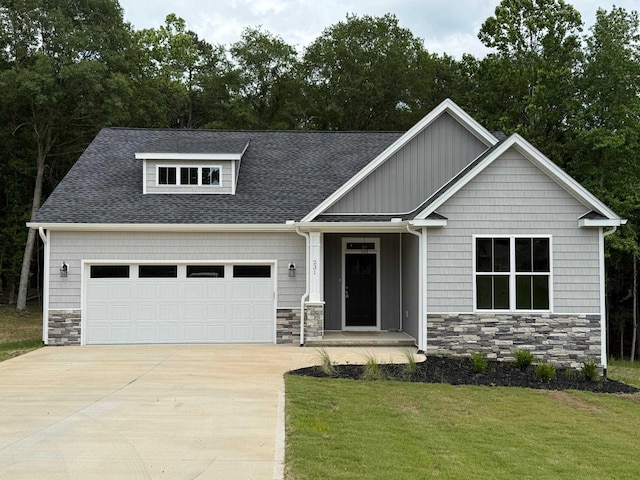 231 Patch, Spartanburg, SC 29302 - craftsman-style house featuring stone siding, an attached garage, concrete driveway, and a front lawn