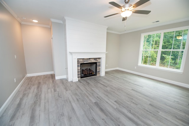 231 Patch, Spartanburg, SC 29302 - unfurnished living room with a stone fireplace, ceiling fan, wood finished floors, ornamental molding, and baseboards
