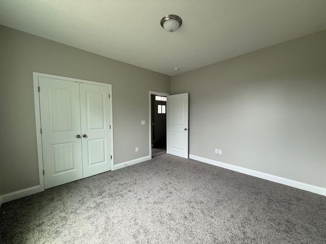 231 Patch, Spartanburg, SC 29302 - unfurnished bedroom featuring carpet flooring, a closet, and baseboards