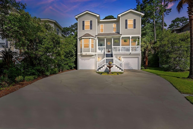 16 Peregrine, Hilton Head Island, SC 29926 - coastal inspired home featuring a porch, stairs, a garage, and concrete driveway