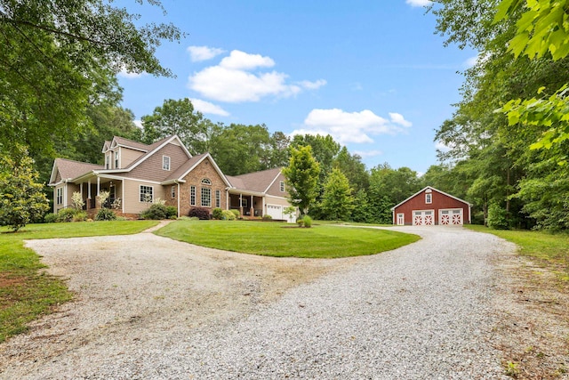 2131 Brockman Mcclimon, Greer, SC 29651 - traditional-style home featuring a garage, an outdoor structure, a front lawn, and view of scattered trees