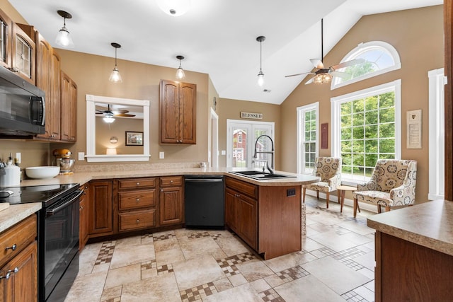 2131 Brockman Mcclimon, Greer, SC 29651 - kitchen featuring black appliances, a ceiling fan, a peninsula, a sink, and brown cabinetry