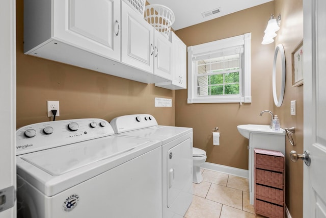 2131 Brockman Mcclimon, Greer, SC 29651 - laundry area featuring independent washer and dryer, baseboards, and light tile patterned floors