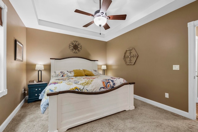 2131 Brockman Mcclimon, Greer, SC 29651 - bedroom featuring light carpet, baseboards, a tray ceiling, and ceiling fan