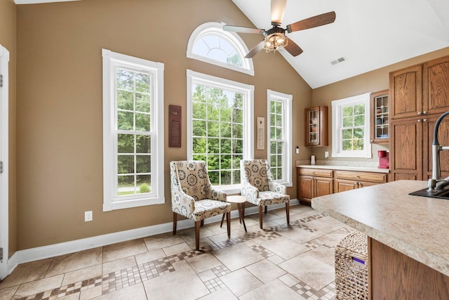 2131 Brockman Mcclimon, Greer, SC 29651 - living area featuring healthy amount of natural light, baseboards, ceiling fan, high vaulted ceiling, and light tile patterned floors