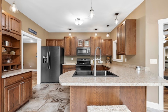 2131 Brockman Mcclimon, Greer, SC 29651 - kitchen featuring fridge with ice dispenser, stainless steel microwave, black range with electric stovetop, a peninsula, and light countertops