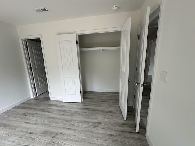 193 Ohio, Chesnee, SC 29323 - unfurnished bedroom featuring light wood-style floors, a closet, and baseboards