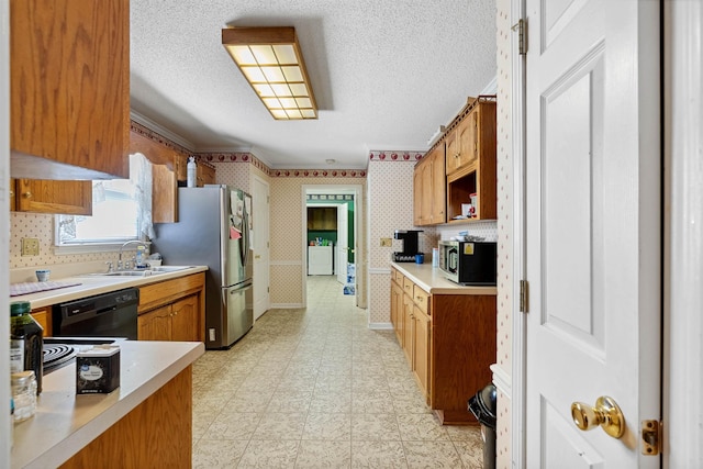 11 Midland, Taylors, SC 29687 - kitchen featuring appliances with stainless steel finishes, a sink, light countertops, wallpapered walls, and a textured ceiling