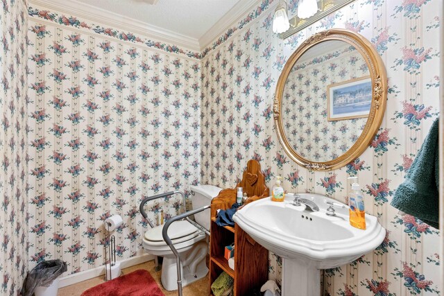 11 Midland, Taylors, SC 29687 - half bathroom with wallpapered walls, crown molding, toilet, and baseboards