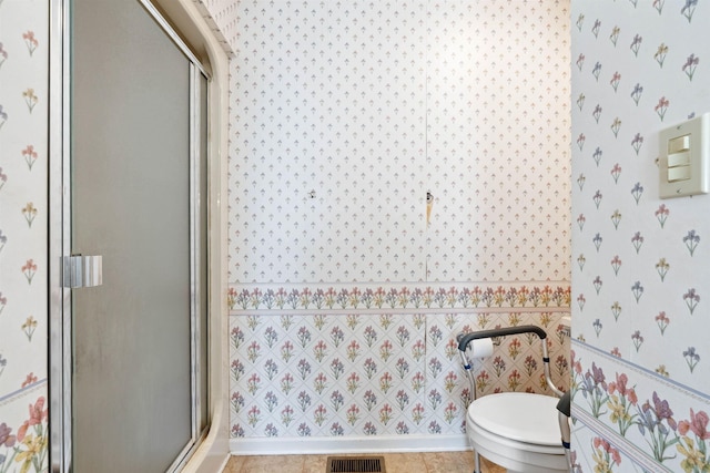 11 Midland, Taylors, SC 29687 - full bathroom with wallpapered walls, a shower stall, and toilet