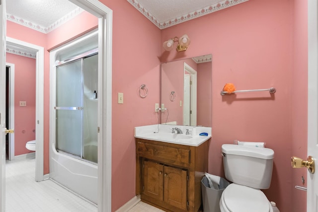 11 Midland, Taylors, SC 29687 - bathroom featuring toilet, vanity, a textured ceiling, enclosed tub / shower combo, and baseboards