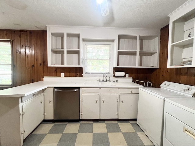 453 Lucerne, Spartanburg, SC 29302 - kitchen featuring open shelves, stainless steel dishwasher, a sink, wood walls, and independent washer and dryer