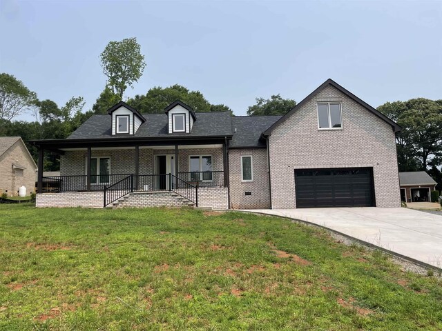 115 Hickory Hollow Rd, Inman, SC 29349 - view of front of home featuring a garage, a porch, concrete driveway, a front lawn, and brick siding