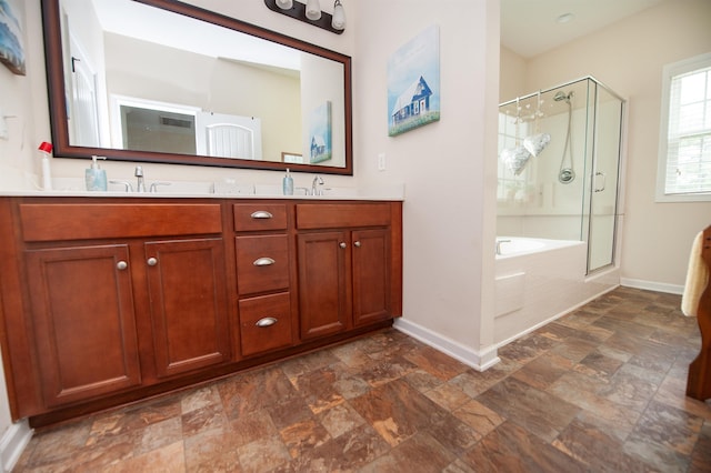 175 Castleton, Boiling Springs, SC 29316 - full bath with baseboards, stone finish floors, a shower stall, double vanity, and a tub