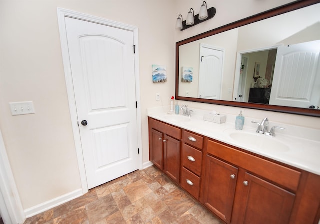 175 Castleton, Boiling Springs, SC 29316 - bathroom with double vanity, stone finish flooring, and baseboards