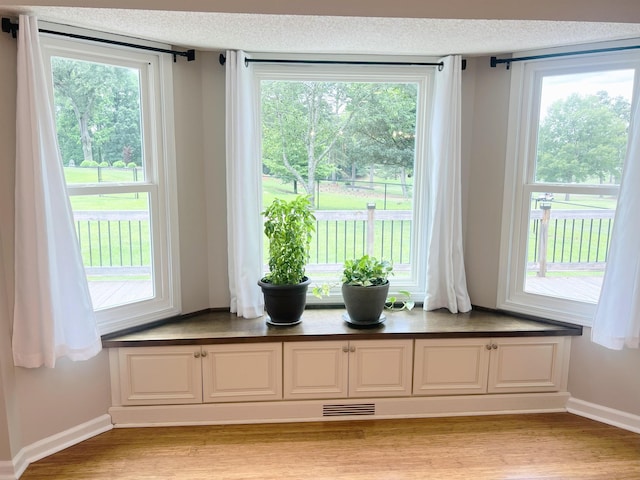 760 Three Wood, Woodruff, SC 29388 - living area with light wood-type flooring, baseboards, and a textured ceiling