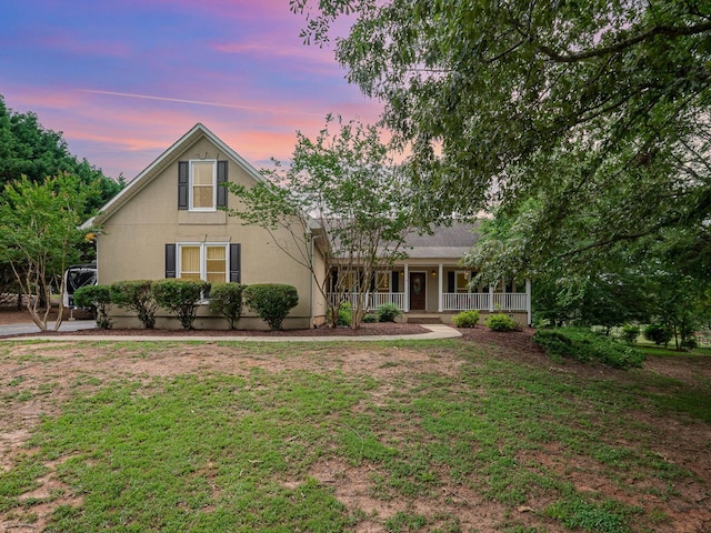 760 Three Wood, Woodruff, SC 29388 - view of front of property featuring a porch, a yard, and stucco siding